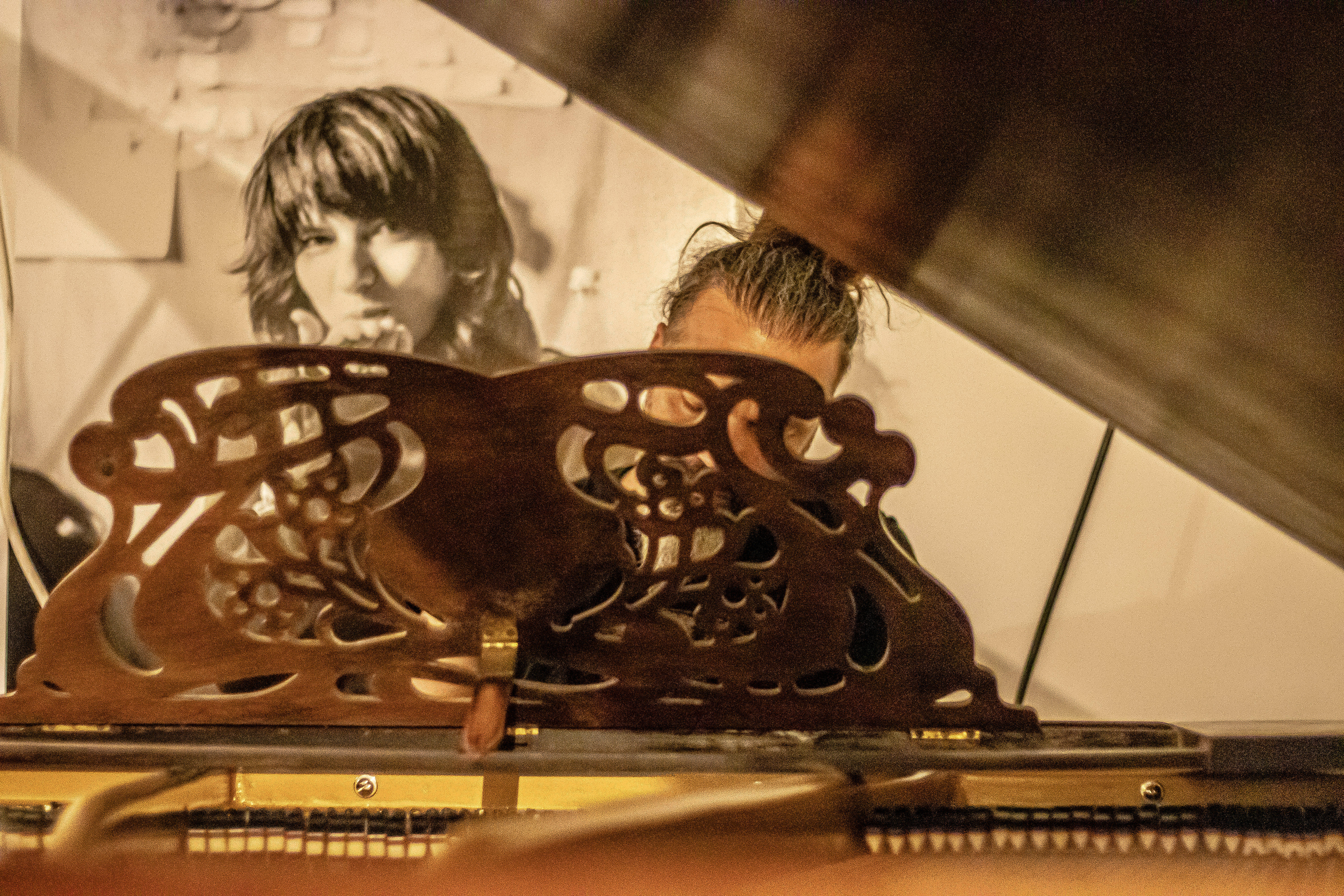 George Bokos (Grindhouse Studios Athens/Spine Audio) with the John Broadwood & Sons grand piano and a large photographic print behind him.